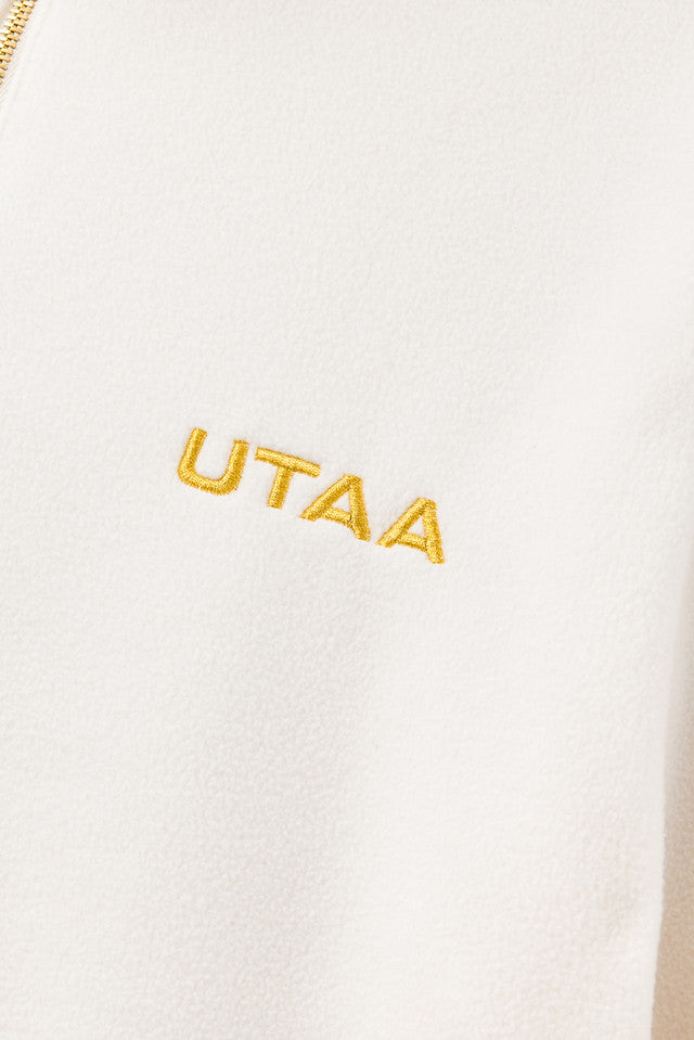 UTAA ギルトロゴハーフジップアップフリース ホワイト:レディース