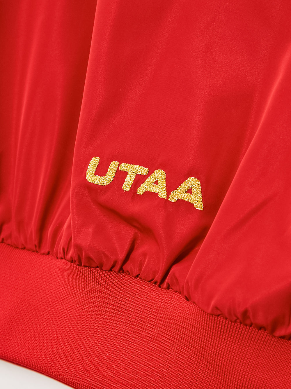 UTAA ゴールデンマークアイコニックウインドブレーカージャンパー レッド : Women's