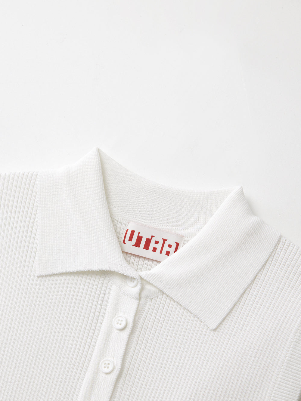 UTAA シンボルニットスリーブレスシャツ ホワイト : Women's