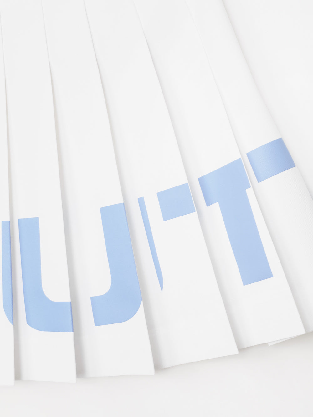 ユタ チェリッシュボールドロゴプリーツスカート