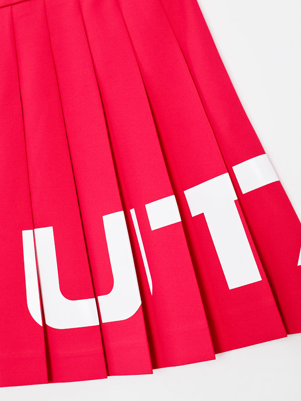 ユタ チェリッシュボールドロゴプリーツスカート