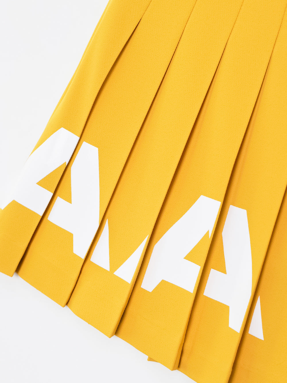 ユタ チェリッシュボールドロゴプリーツスカート