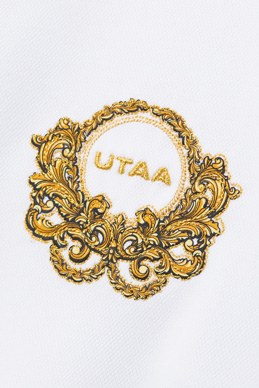 UTAA クレストゴールデンエンブレムPK Tシャツ ホワイト：レディース
