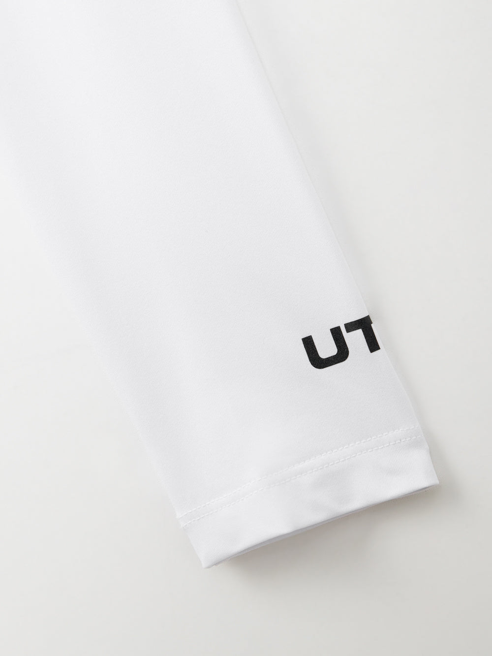 UTAA モノラルビンディングPKスリーブ (女性用) ホワイト