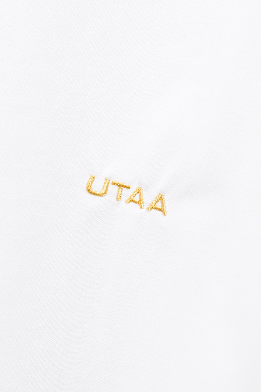 UTAA クレストゴールデンパンサージップアップPKシャツ ホワイト：メンズ